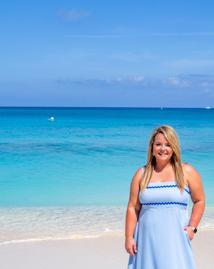 Hannah, owner and travel advisor, enjoying a beautiful beach vacation
